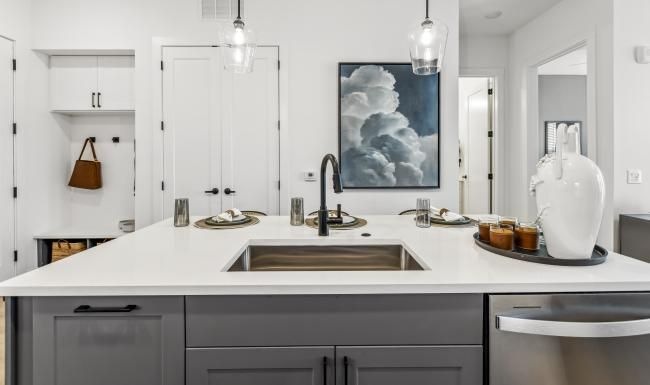 a kitchen with white cabinets
