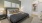 a bedroom with a bed and lamps
